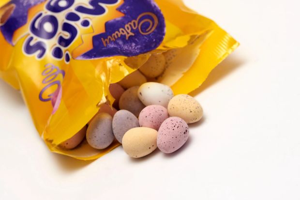 An image collage containing 1 images, Image 1 shows Cadbury Mini Eggs spilling from a bag