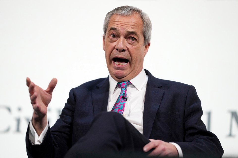 Nigel Farage speaking at a conference.