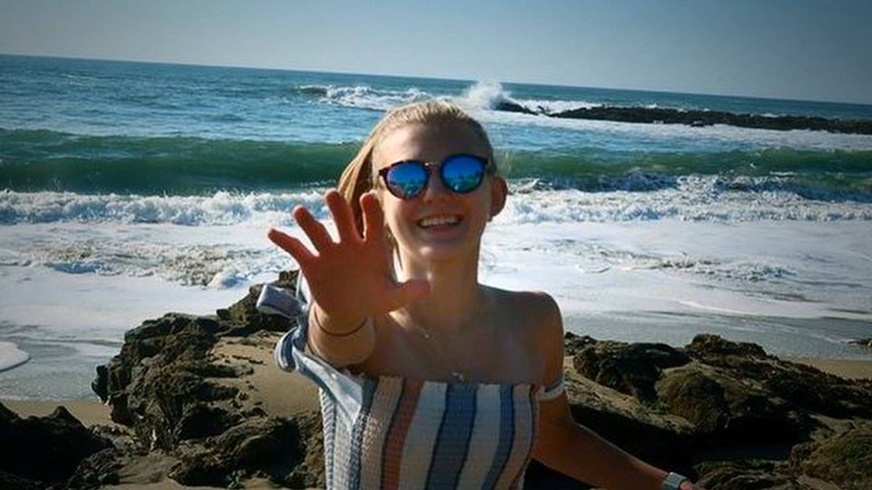 Photo of Gabby Petito at the beach.