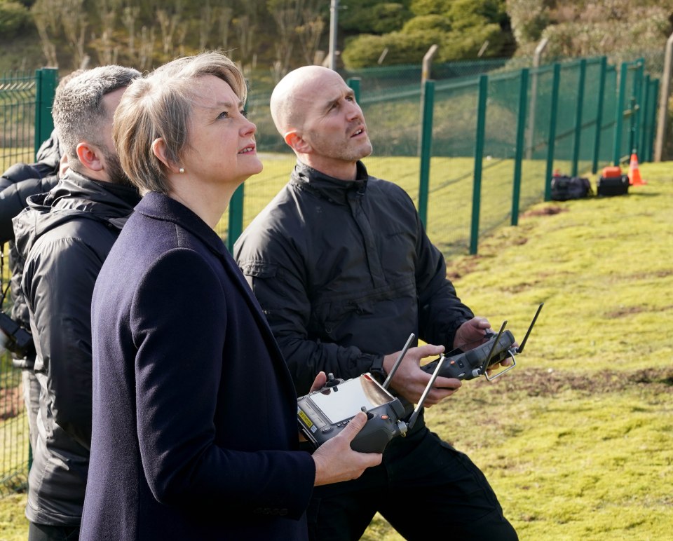 Home Secretary Yvette Cooper watching a drone demonstration.