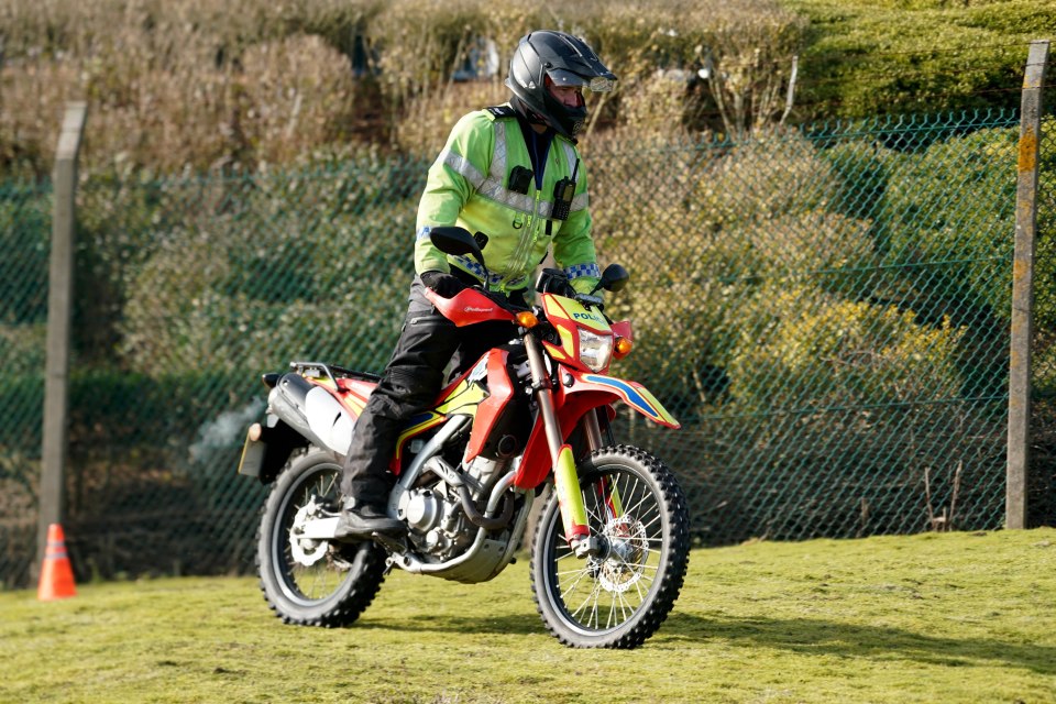 Police officer on a dirt bike.