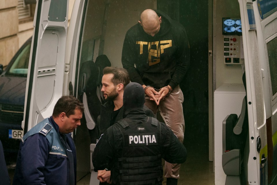 Andrew Tate and his brother escorted by police.