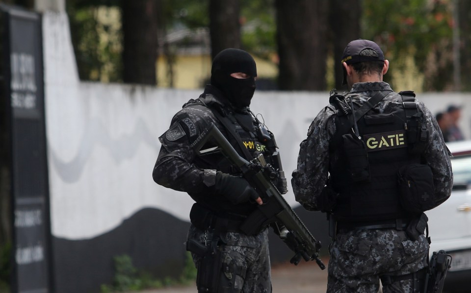 Police officers at a school after a shooting.