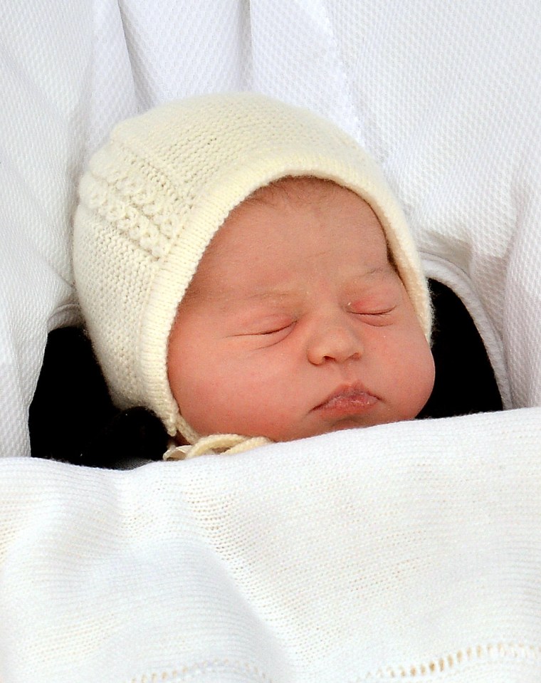 Sleeping newborn Princess Charlotte in a car seat.