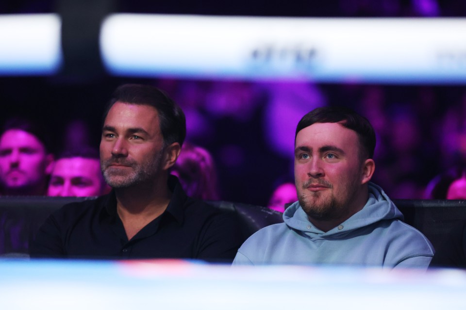 Luke Littler and Eddie Hearn at a boxing match.