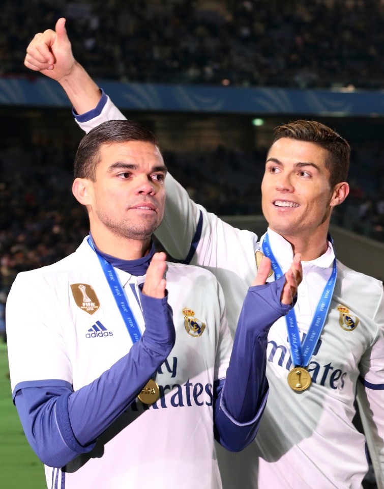 Cristiano Ronaldo and Pepe celebrating a soccer victory.