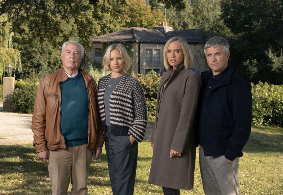 Promotional photo of four actors standing outside a house.