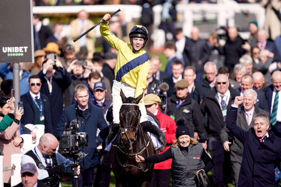 Jockey celebrating a win at the Cheltenham Festival.