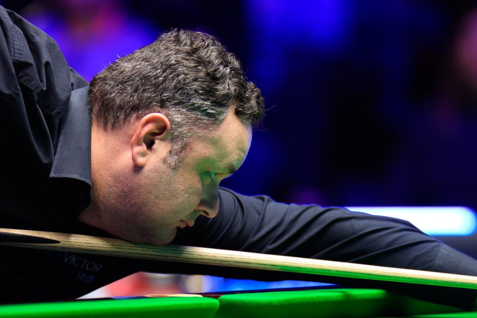Stephen Maguire of Scotland playing snooker.