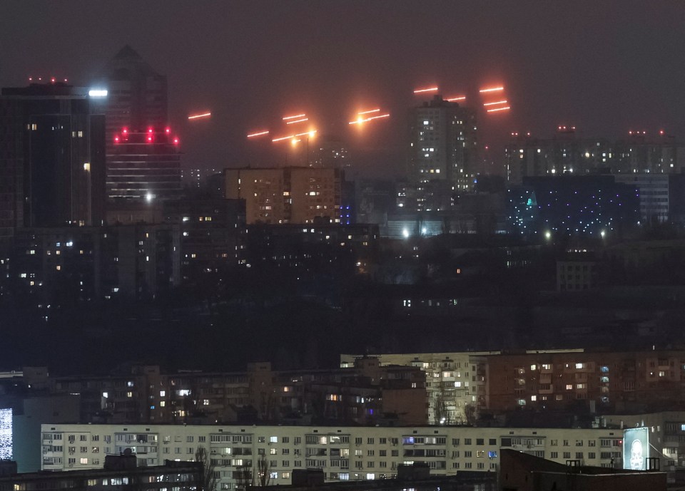 Tracers in Kyiv night sky during a Russian drone strike.