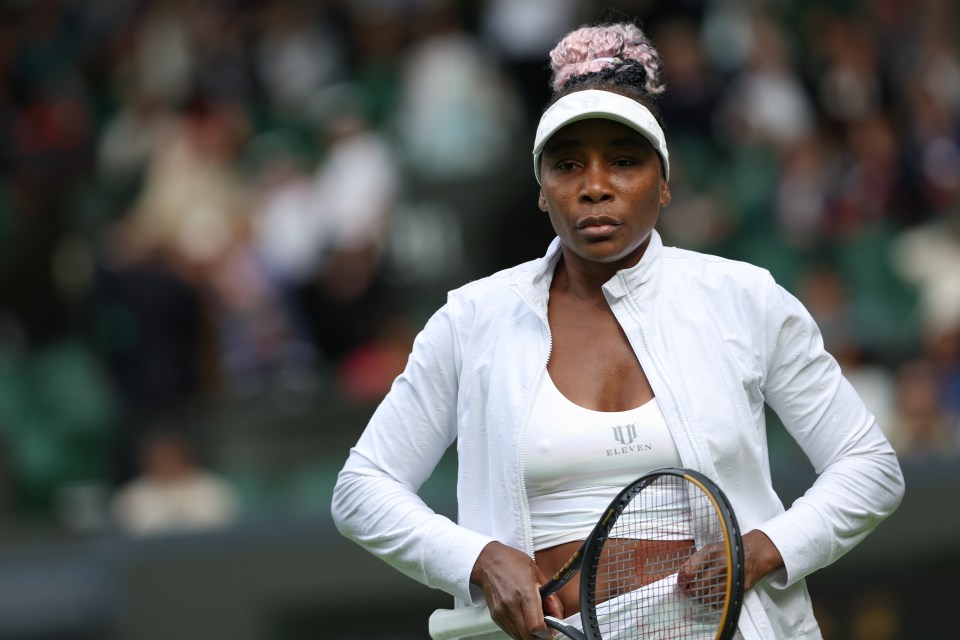 Venus Williams at Wimbledon holding a tennis racket.