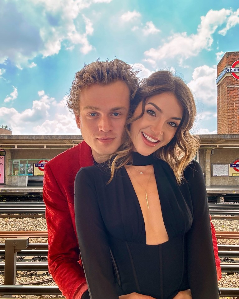 Tristan Evans and Nikki Banner at a train station.
