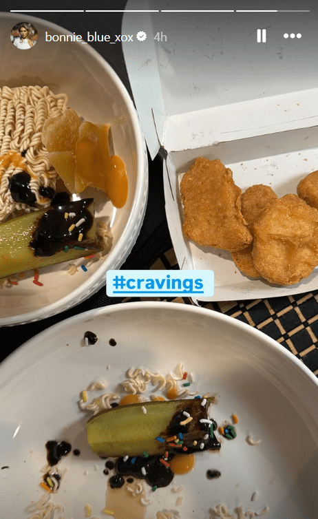 Two bowls of ramen, a pickle, chocolate sauce, and sprinkles; a box of chicken nuggets.