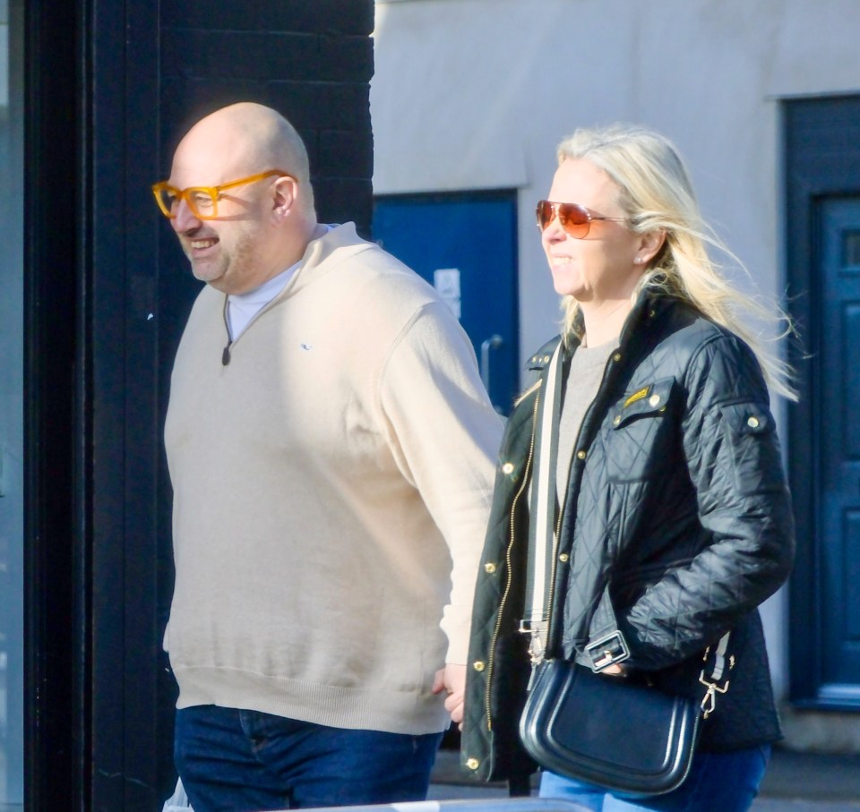 Wynne Evans and Liz Brookes holding hands while shopping.