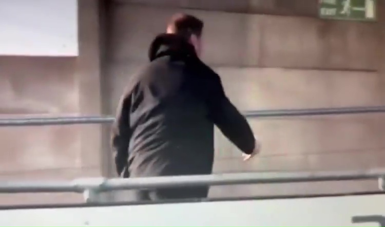 Man walking away from camera.