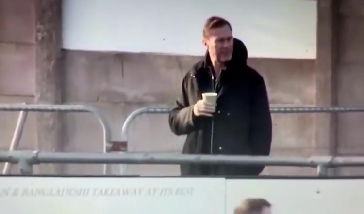 Duncan Ferguson holding a cup.
