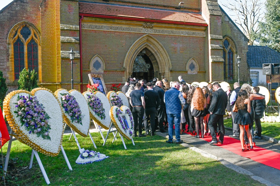 Funeral service attendees at a church.
