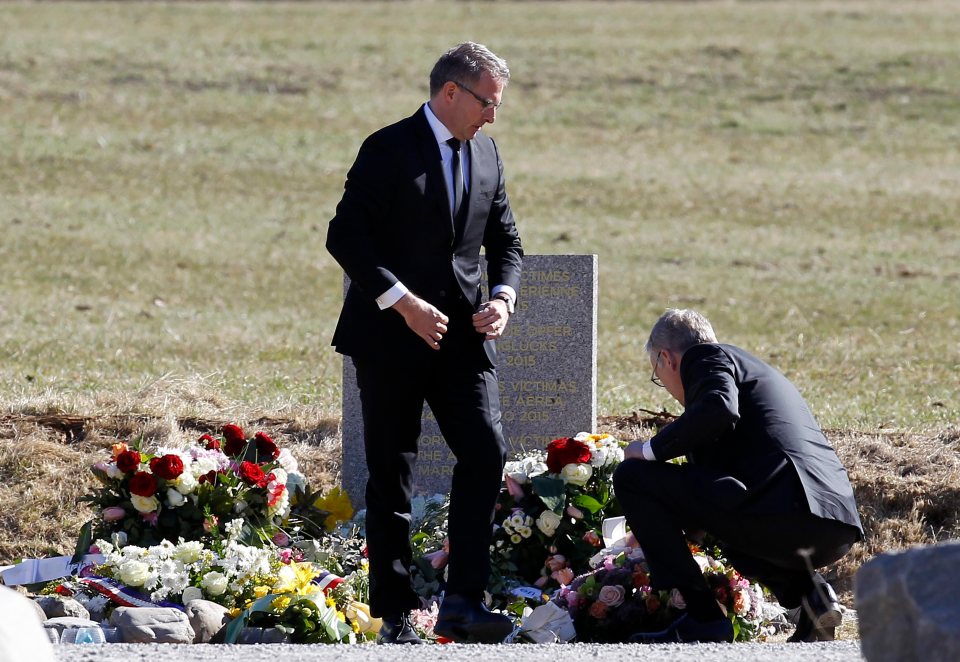 Family members of the Germanwings Airbus A320 pilot mourn at a memorial.