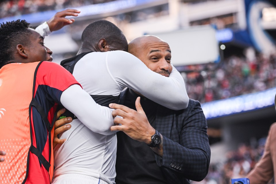 Panama's Cecilio Waterman celebrates a goal with Thierry Henry.