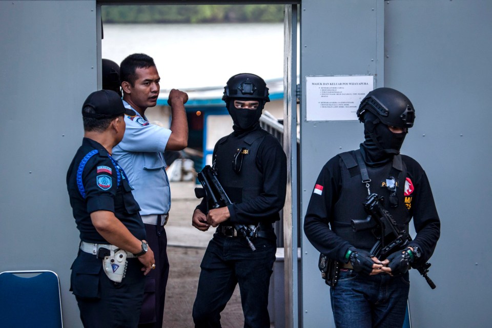 Indonesian police guarding the entrance to Nusakambangan prison.