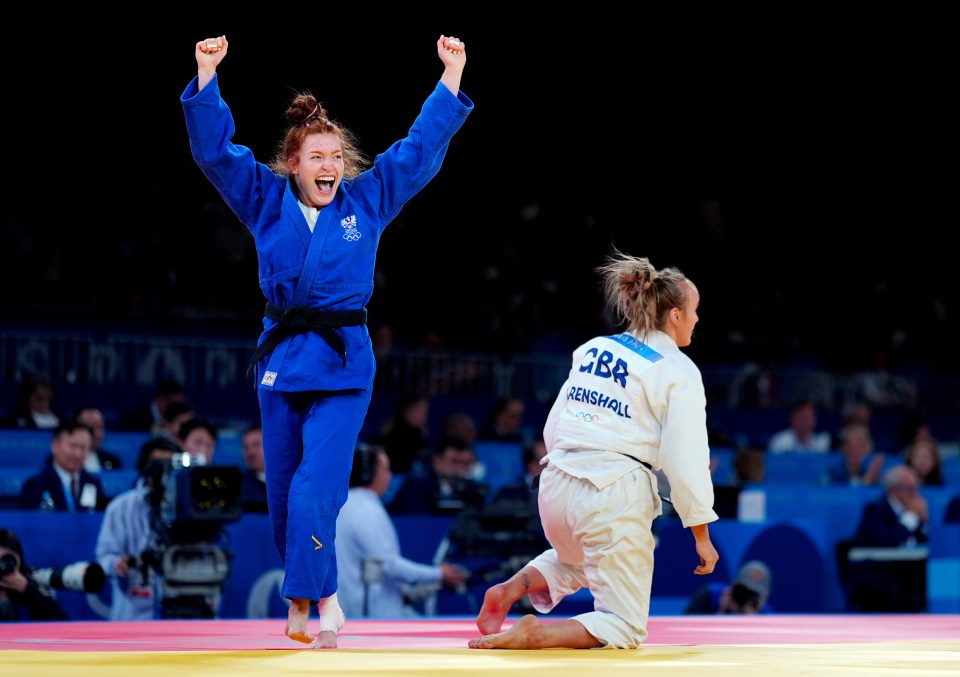 A Judo athlete celebrates victory at the 2024 Paris Olympic Games.