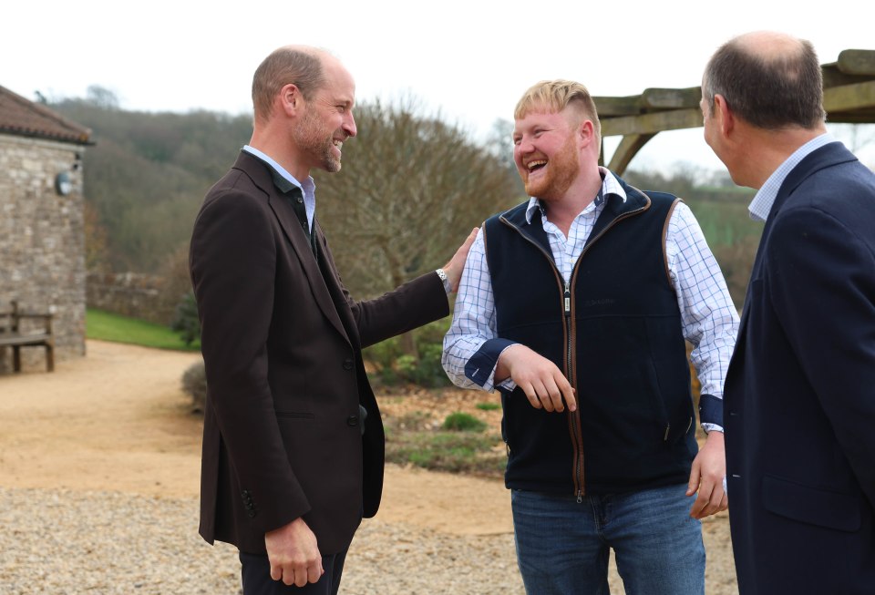 The Duke of Cornwall speaks with young farmers at an event.