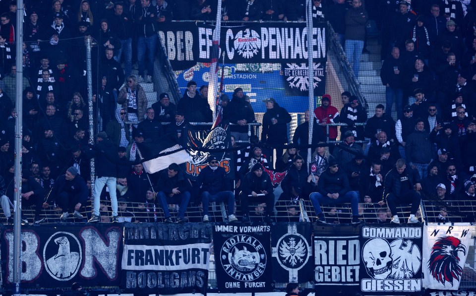 Eintracht Frankfurt fans at a soccer match.