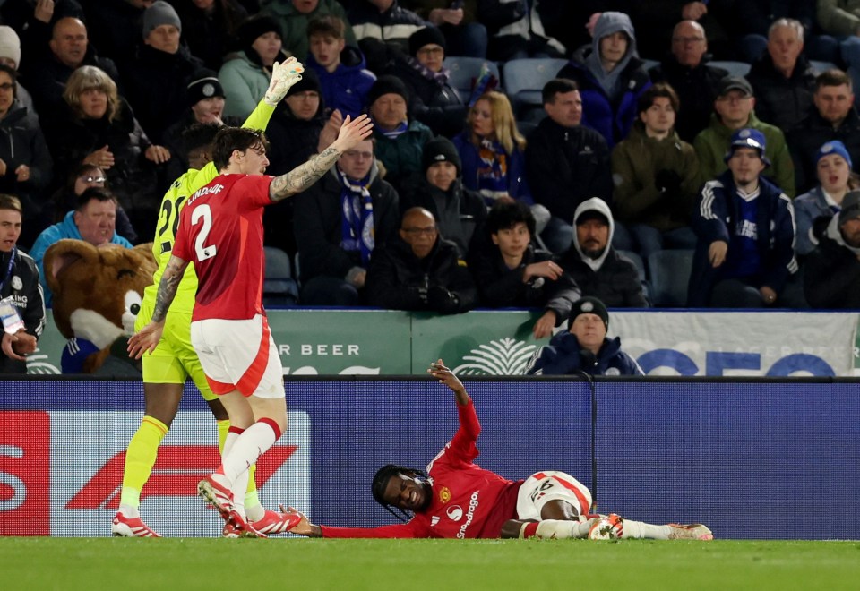 Manchester United's Ayden Heaven injured on the field.