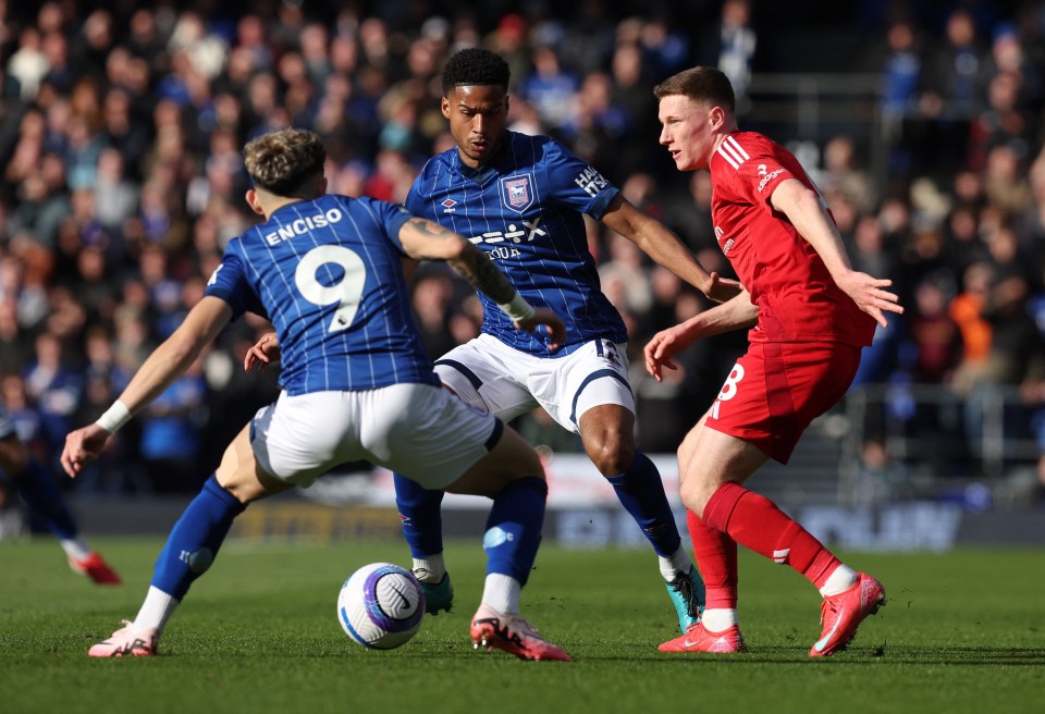Soccer players vying for the ball.