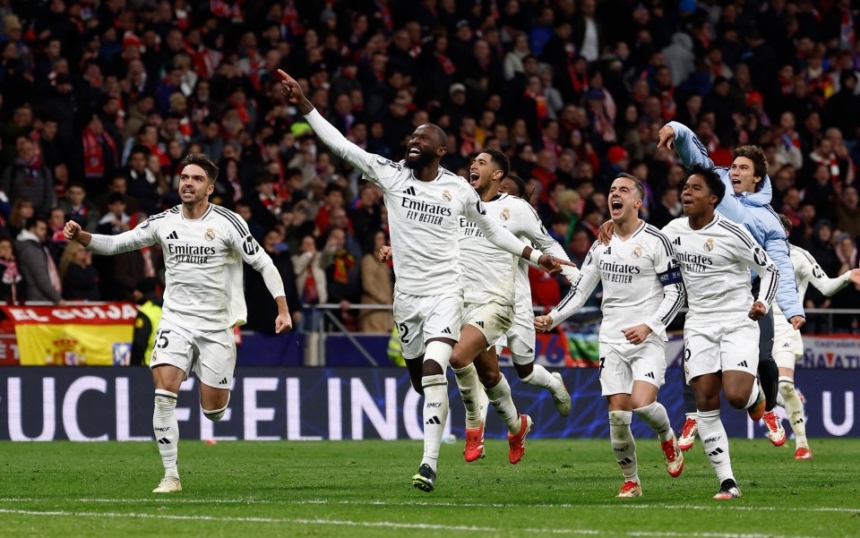 Real Madrid players celebrating a goal.