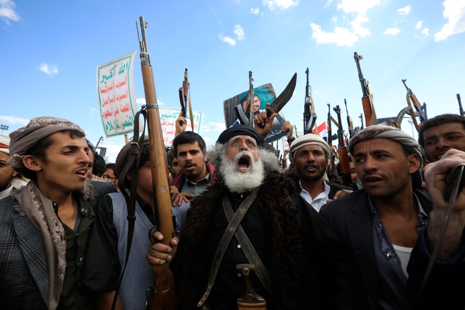 Houthi supporters protesting US airstrikes in Sana'a, Yemen.