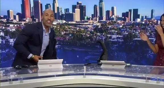 A TV presenter slips and falls live on air.