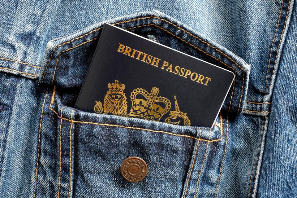 British passport in a denim jacket pocket.