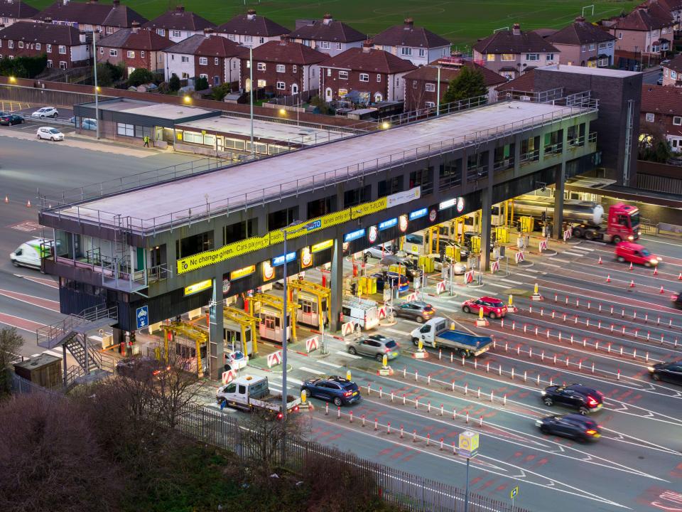Kingsway toll road tunnel entrance with pay booths.