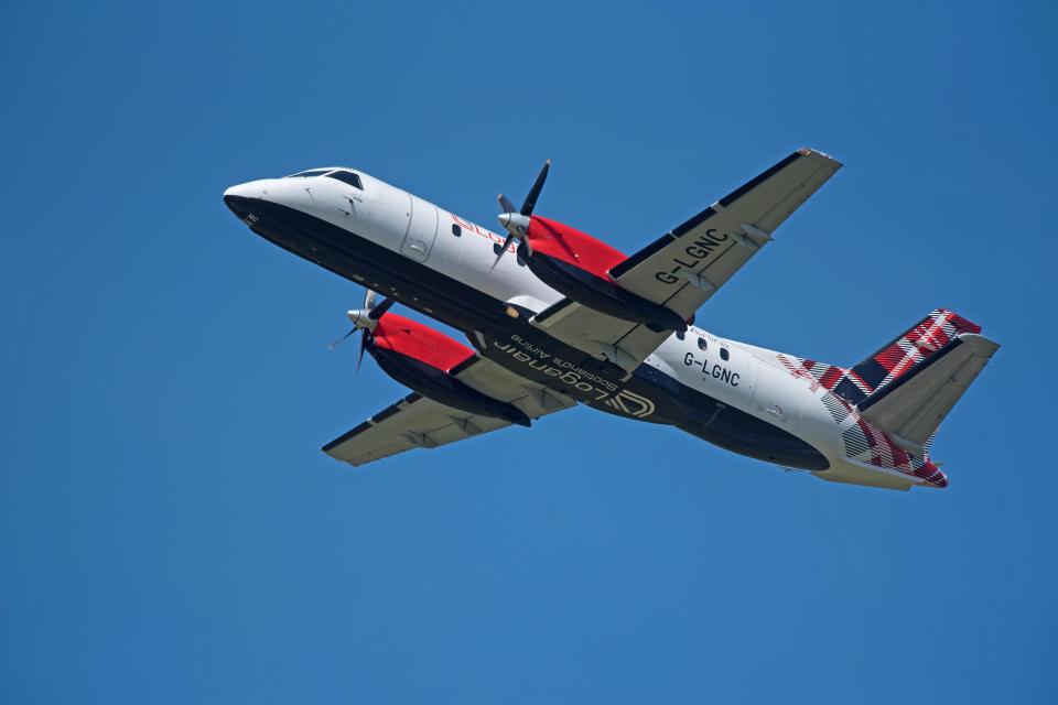 Loganair Saab 340 airplane in flight.