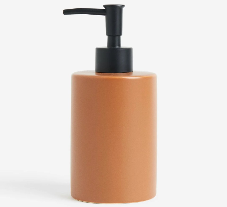 Brown ceramic soap dispenser with black pump.