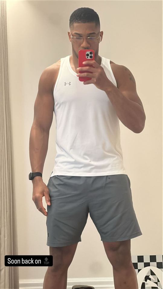 Man in athletic wear taking a selfie.