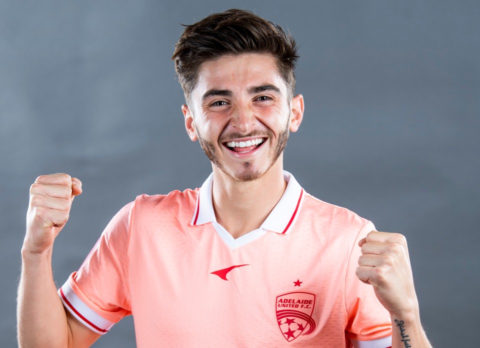 Josh Cavallo in Adelaide United jersey.