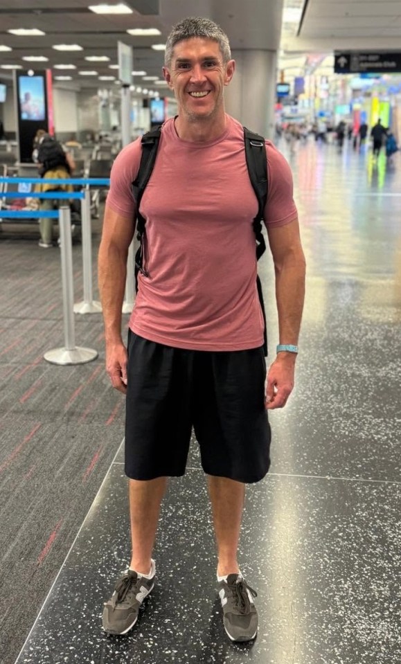 Man in casual clothes at an airport.