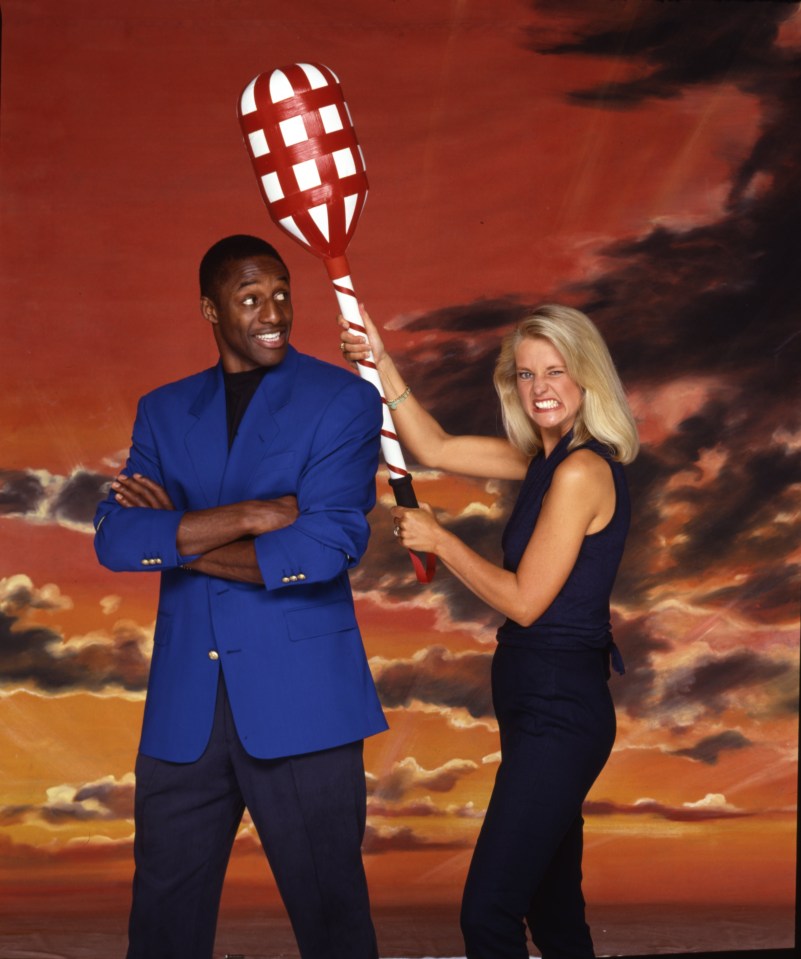 Photo of John Fashanu and Ulrika Jonsson, presenters of the British game show *Gladiators*.