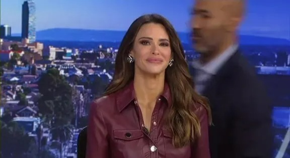 Screenshot of a TV presenter slipping and falling live on air.