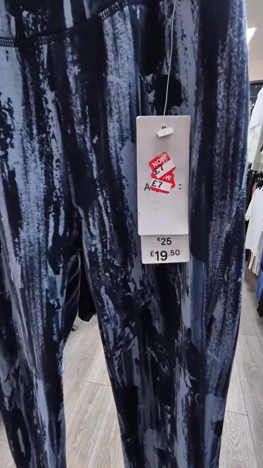Blue and black patterned leggings with price tag showing £19.50.