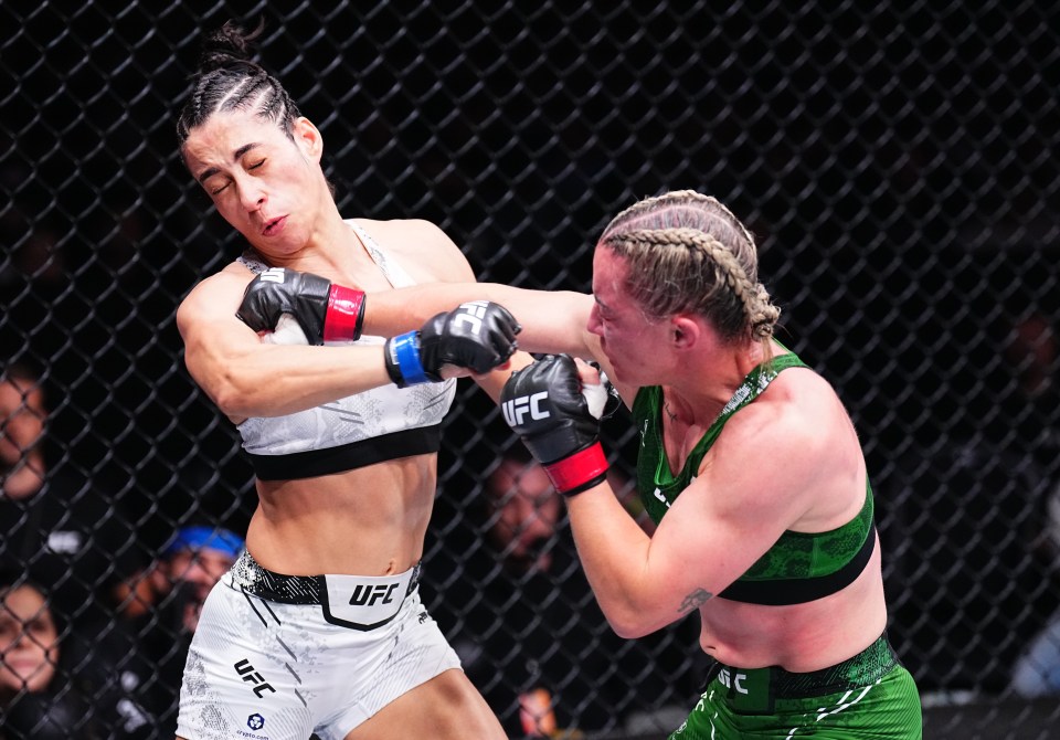 MANCHESTER, ENGLAND - JULY 27: (R-L) Molly McCann of England punches Bruna Brasil of Brazil in a strawweight bout during the UFC 304 event at Co-op Live on July 27, 2024 in Manchester, England. (Photo by Chris Unger/Zuffa LLC via Getty Images)