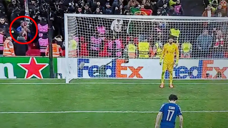Soccer player taking a penalty kick.