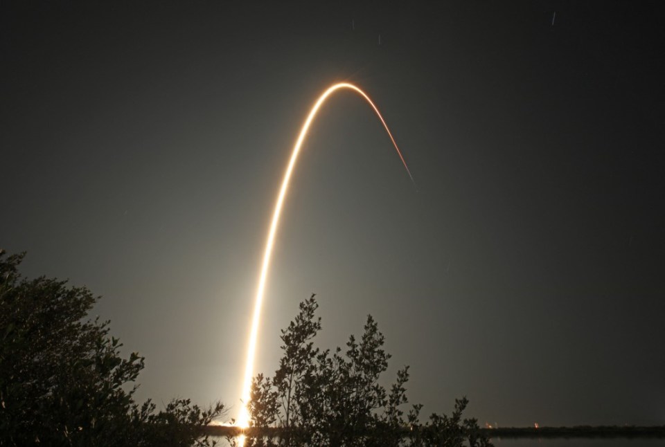 (FILES) Intuitive Machines' Athena lander on top of a SpaceX Falcon 9 rocket streaks toward space after lifting off from Launch Complex 39A at NASA's Kennedy Space Center, Florida, February 26, 2025. More than fifty years passed between the last Apollo mission and America's return to the lunar surface, when the first ever private lander touched down last February. Now, starting March 2, two more missions are set to follow within a single week -- marking a bold push by NASA and its industry partners to make Moon landings a routine part of space exploration. (Photo by Gregg Newton / AFP) (Photo by GREGG NEWTON/AFP via Getty Images)