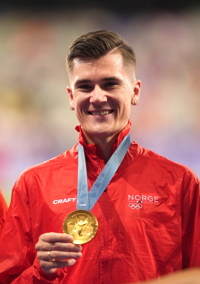 Jakob Ingebrigtsen of Norway holding his gold medal at the 2024 Paris Olympics.