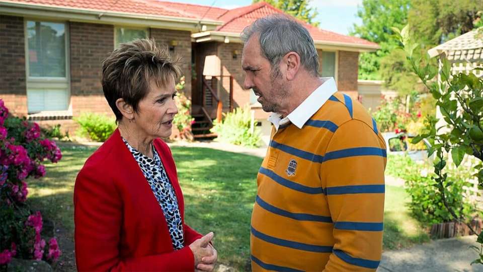 Susan and Karl, neighbors, having a serious conversation.
