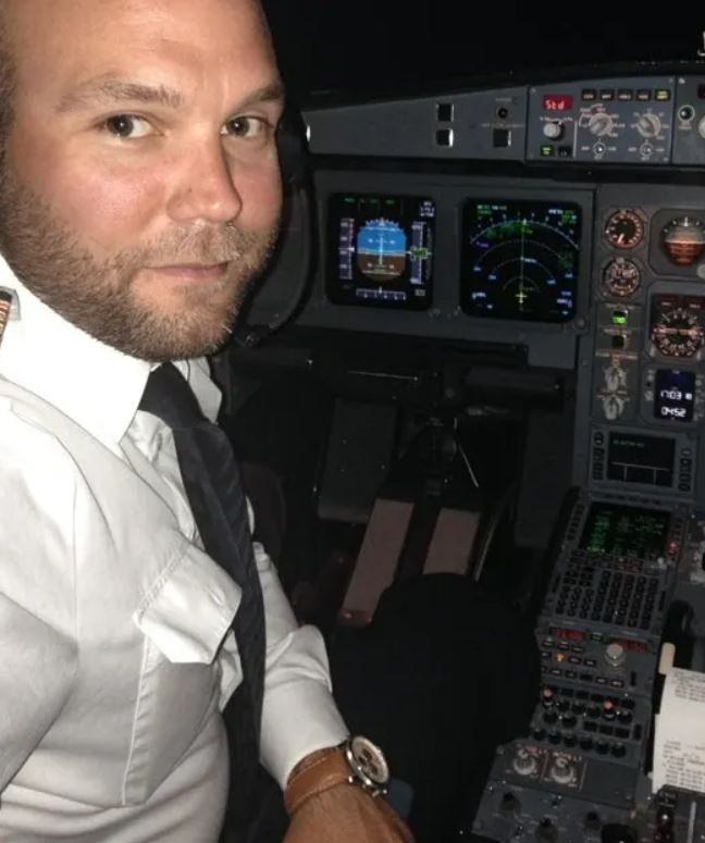 Portrait of Patrick Sondenheimer in a plane cockpit.