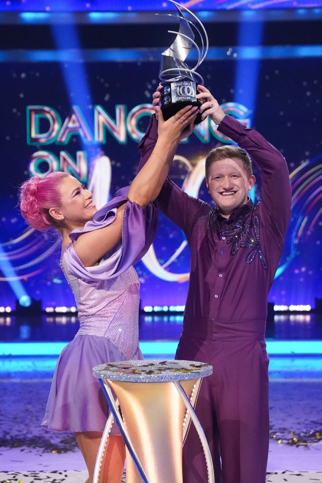 Sam Aston and Molly Beth Lanaghan, winners of Dancing on Ice, holding the trophy.