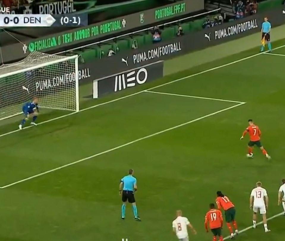 Soccer player taking a penalty kick.